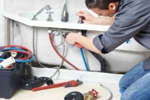 plumber performing maintenance