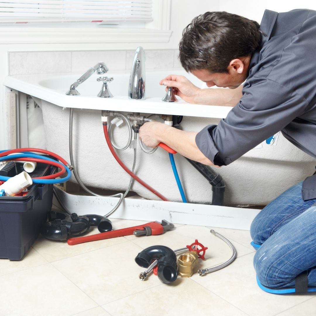 plumber performing maintenance