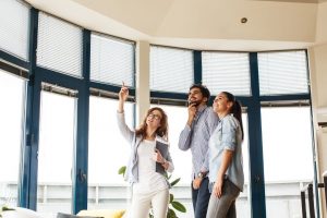 Couple touring house with a real estate agent